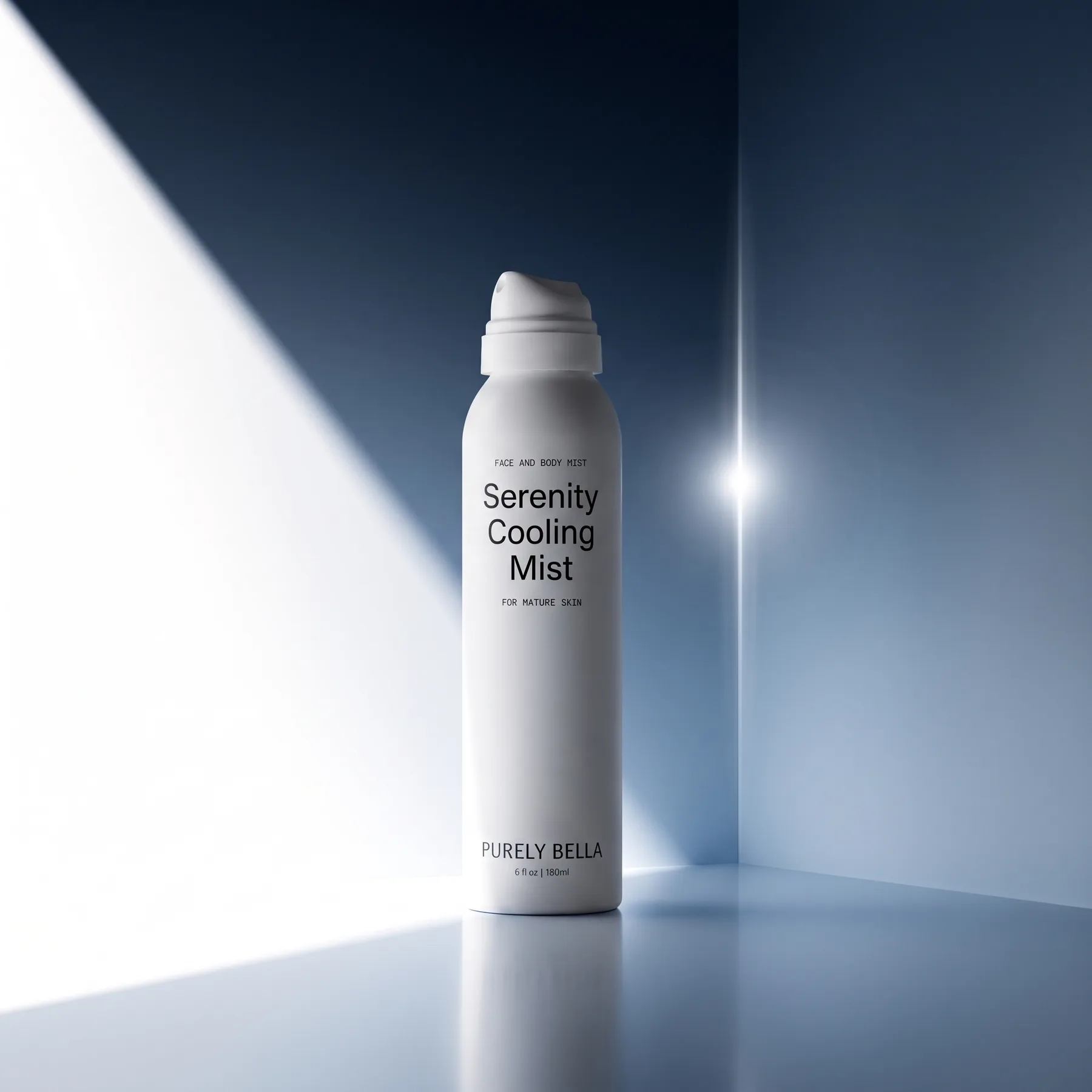Purely Bella Serenity Cooling Mist standing in a blue corner set cut by a hard shaft of light