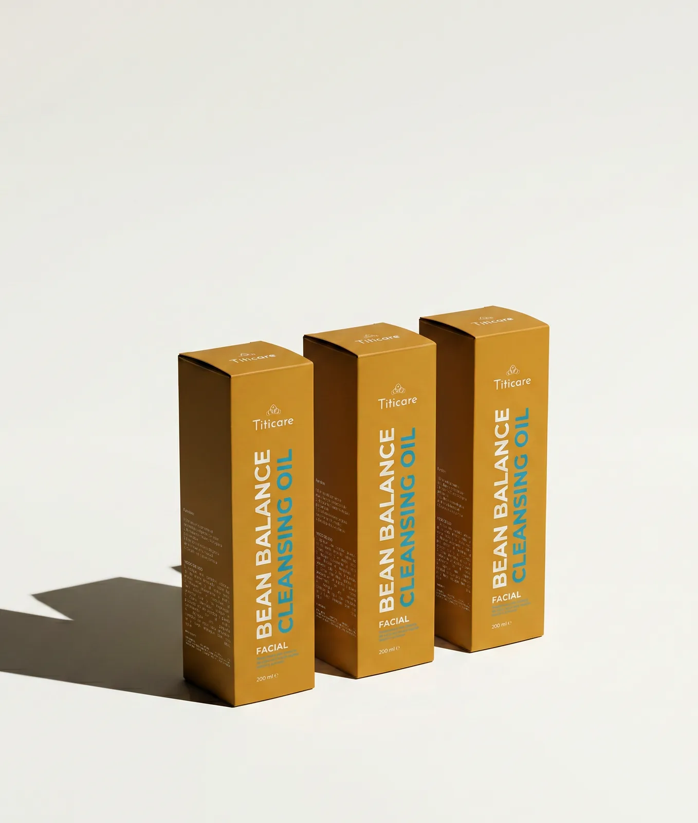 Three Titicare cartons in a row casting long daylight shadows