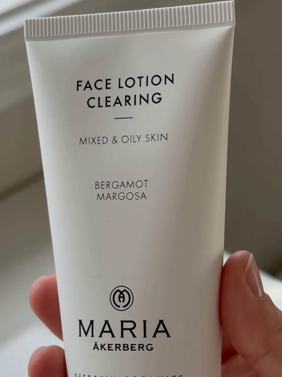 Close-up of the Maria Åkerberg Face Lotion Clearing tube held in hand